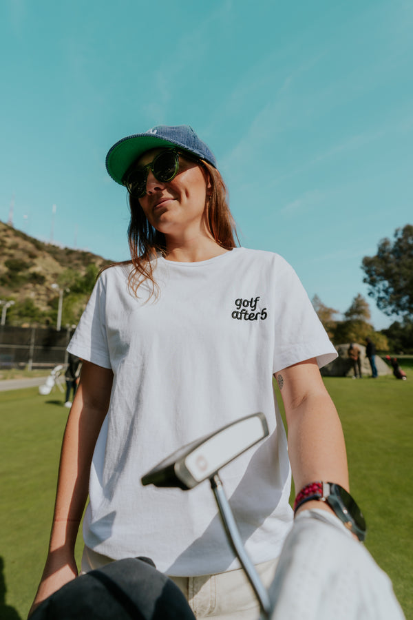 Golf After 5 "Golf More, Work Less" women's white t-shirt, front view, female model