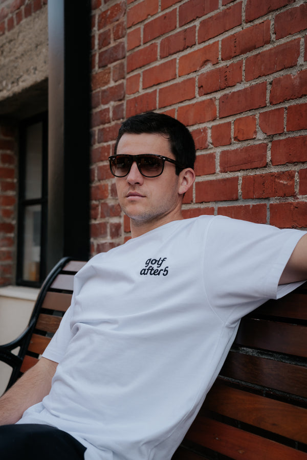 Golf After 5 "Golf More, Work Less" men's white t-shirt, front view, male model