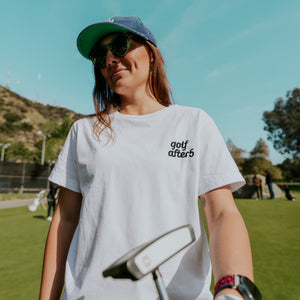 Golf After 5 "Golf More, Work Less" women's white t-shirt, front view, female model