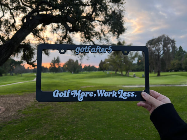 Golf After 5 "Golf More, Work Less" license plate with raised white lettering, universal fitting sizing, front view